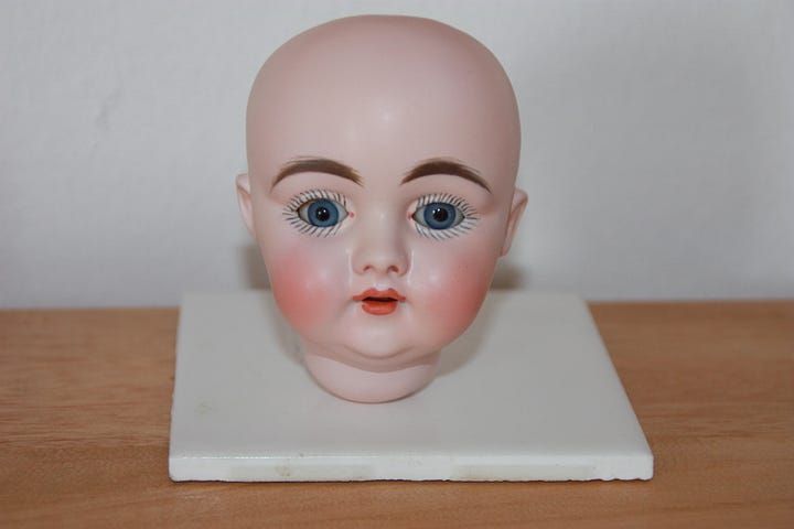 The restored porcelain head of the doll. 