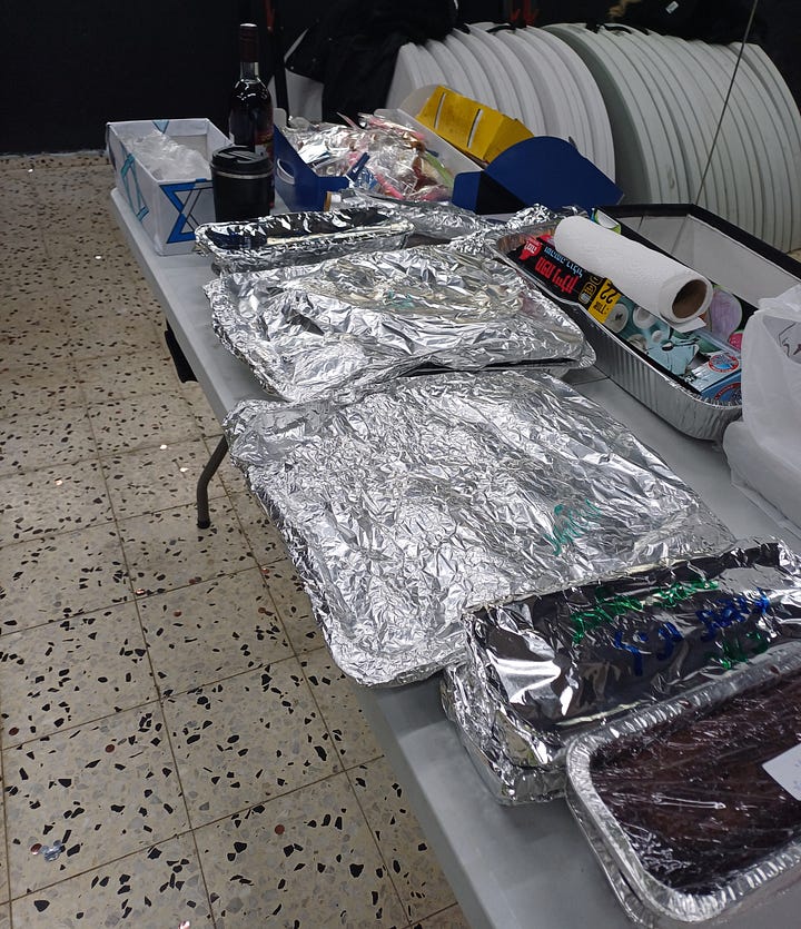 Boxes, table of wrapped food, Sabbath ritual items 
