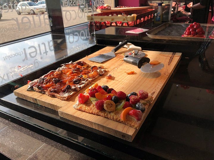 A bakery with croissants, coffee, pastries and chocolates