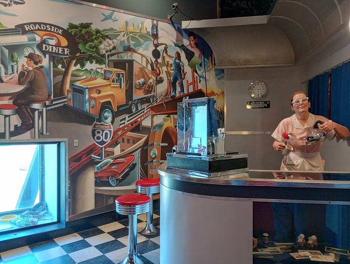 Diner counter with manikin as waitress, and view out of window, with radar detactor