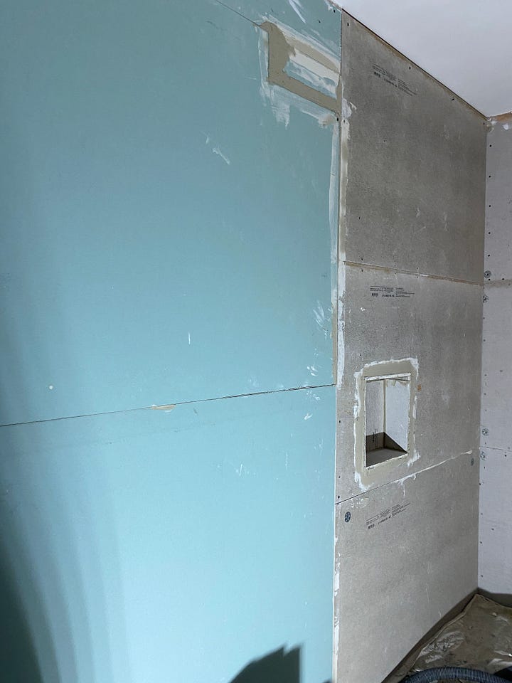 newly painted ceiling in white and the wall plaster boarded