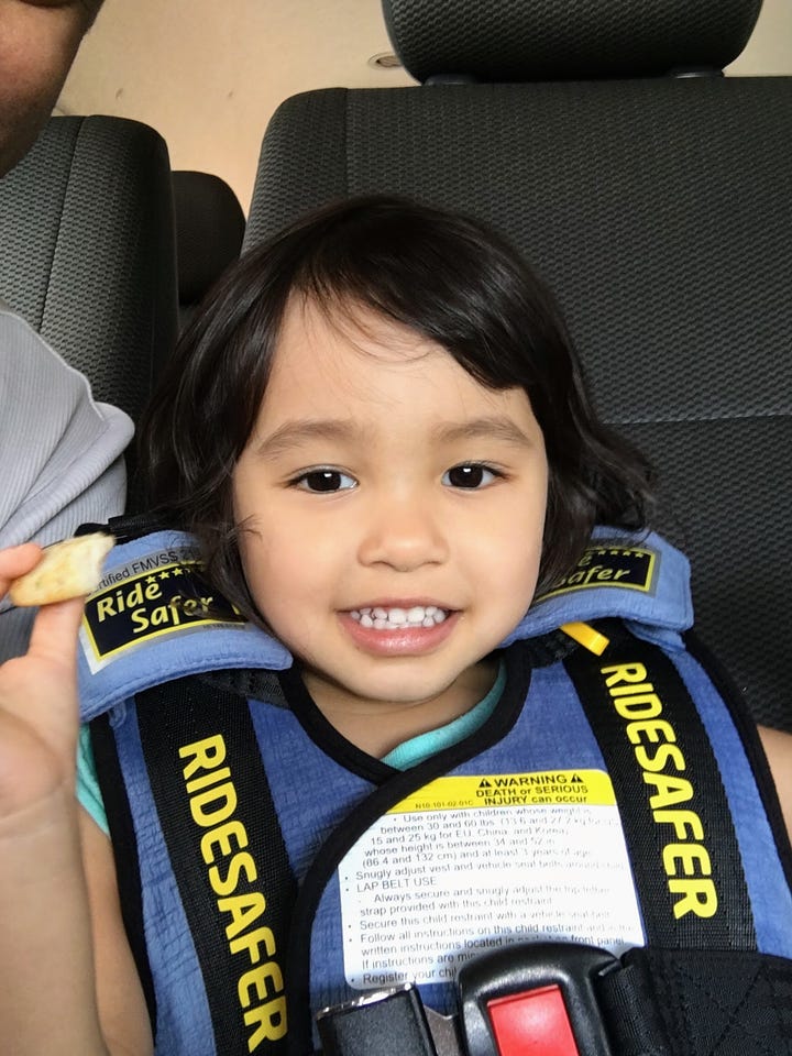 Left: little girl in a car safety vest holding a snack; Right: hand holding a mifold booster seat.
