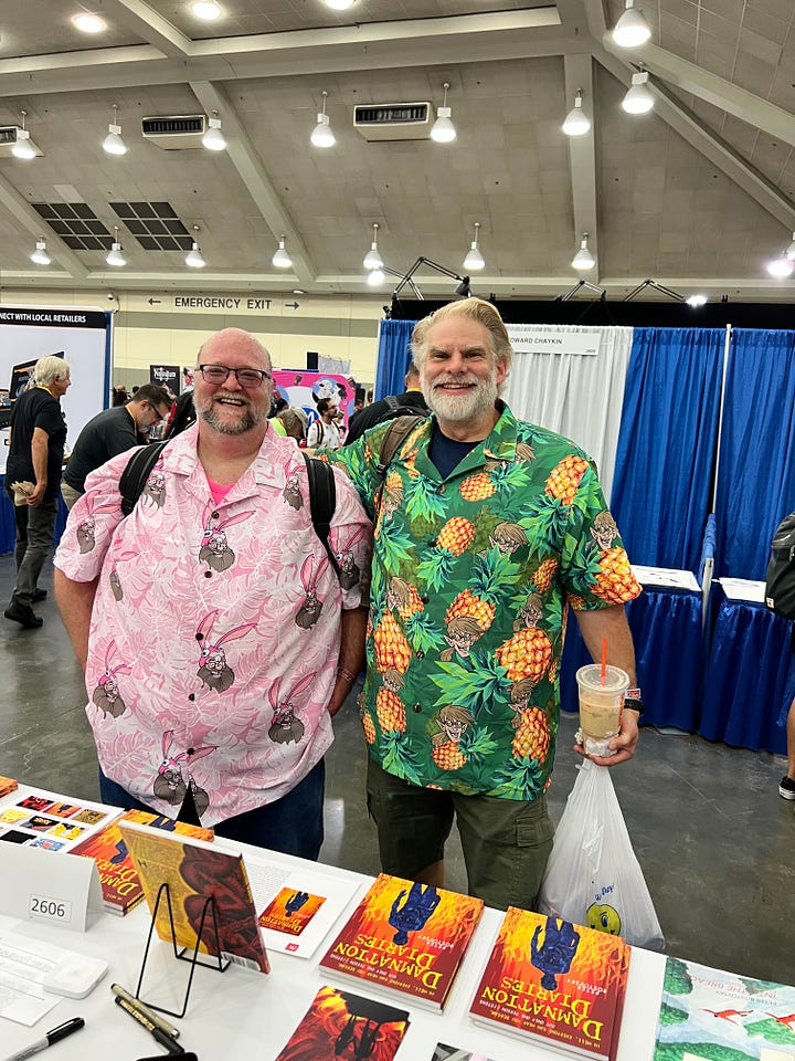 Pictures of Derek J. Bush and John Pasquini at Baltimore Comic-con 2023. The second picture includes my lovely lady, Suzanne McElvy. She the one with the glasses and no beard.