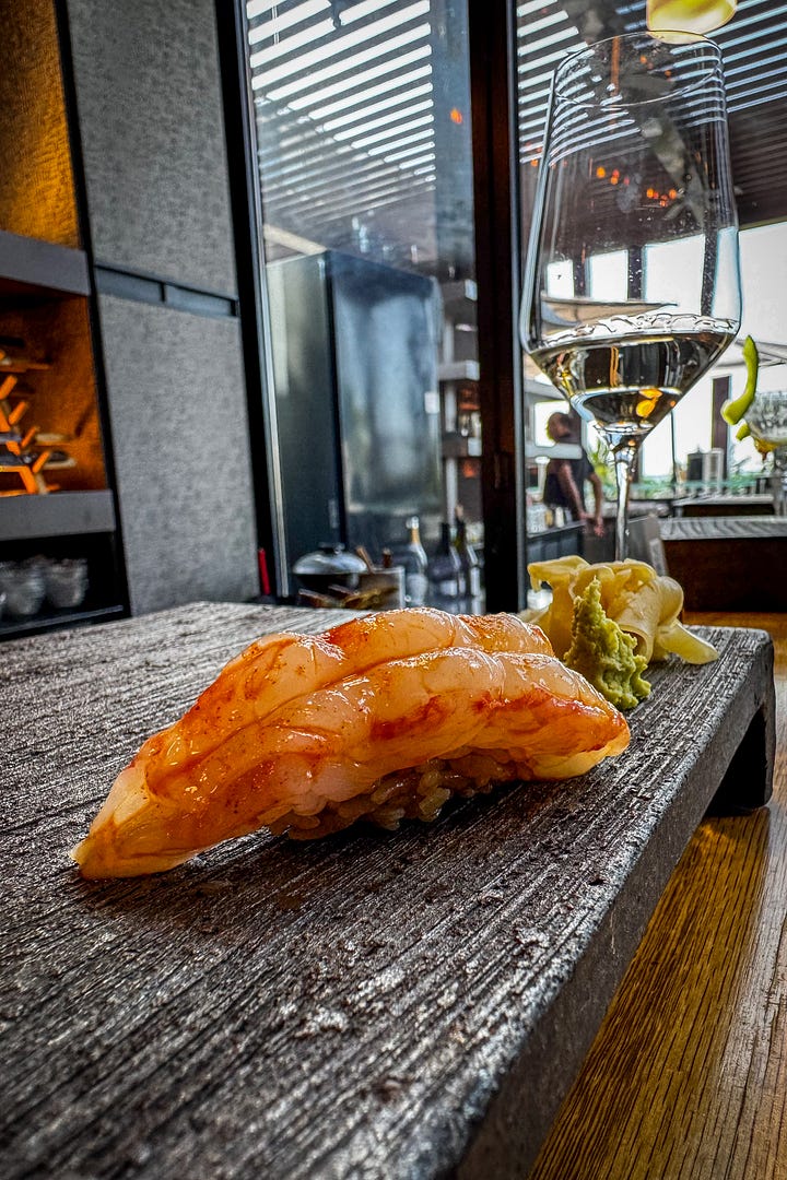 A selection from the sushi omakase: botan shrimp, blushing fatty tuna, ochre creamy uni and conger eel.