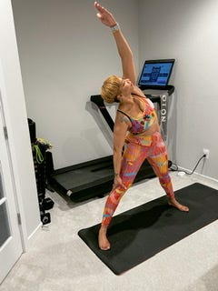All four pictures of a woman working out, one picture doing yoga, another lifting weights, and another on the treadmill.