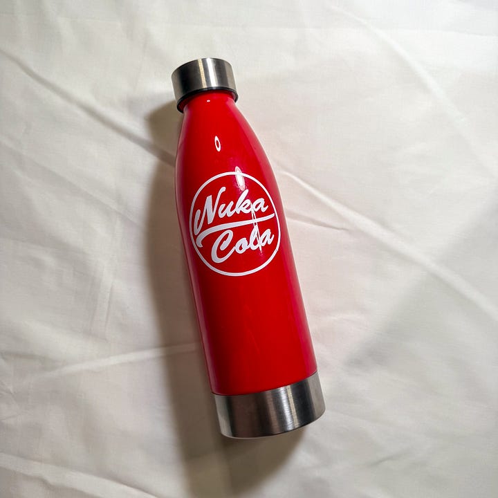 Red and silver water bottles with the words 'Nuka Cola'