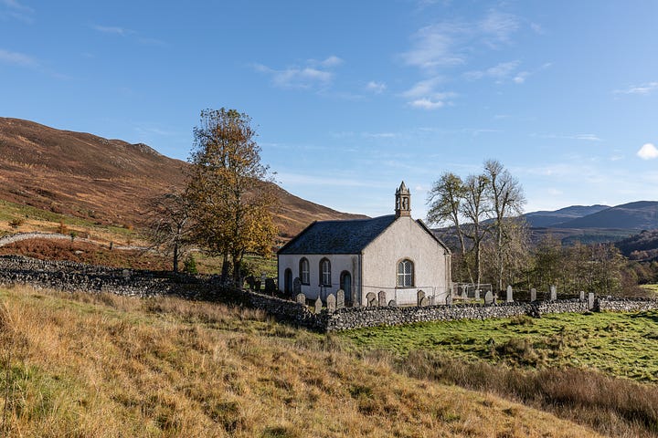 Croick Church within its walled churchyard.