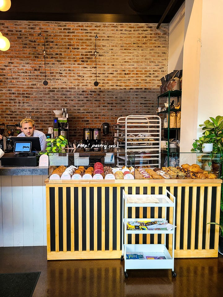 Parable Cafe interior pastry case and front register