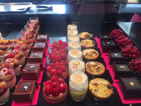 A bakery with croissants, coffee, pastries and chocolates