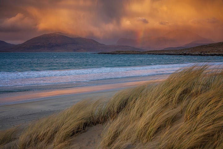 Images of sunset over the beach at Luskentyre, Isle of Harris, Scotland, including gorgeous warm light and a rainbow over the Harris Hills