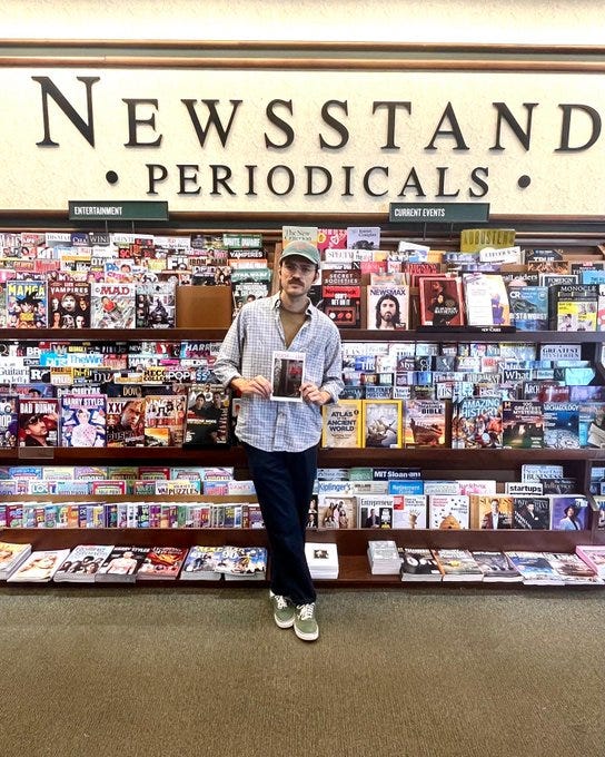 a photo of a Printernet issue with a green cover, a photo of me holding my published short story in an Atlanta Barnes and Noble, a selfie in a public art sculpture, a dry gin martini with a twist