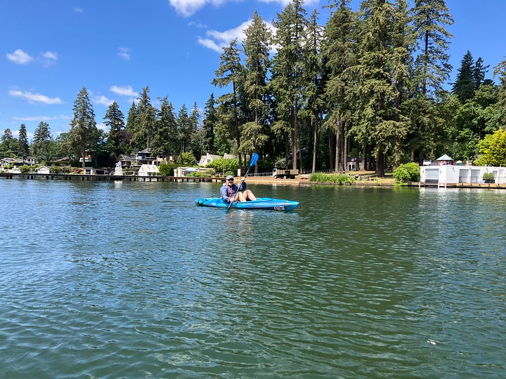 Images of Lake Oswego, Oregon and people paddling in kayaks