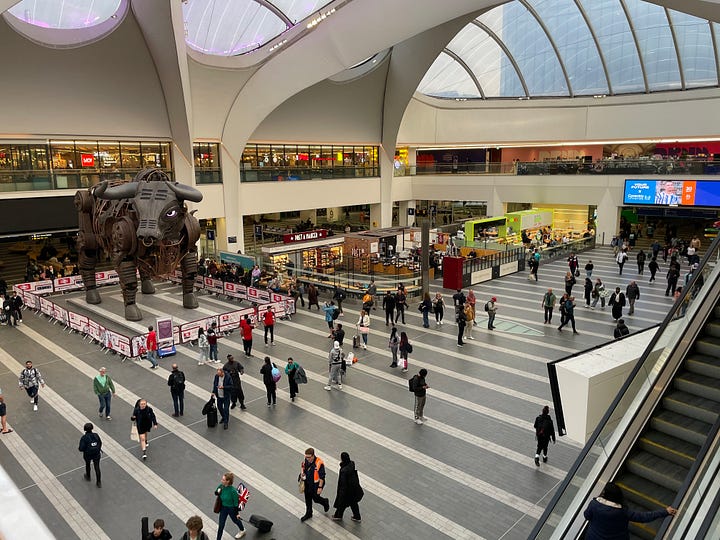 Various pictures of transport in the UK's second city. They include trams, excellent public spaces, hire bikes, Birmingham New Street Station, and Black Sabbath