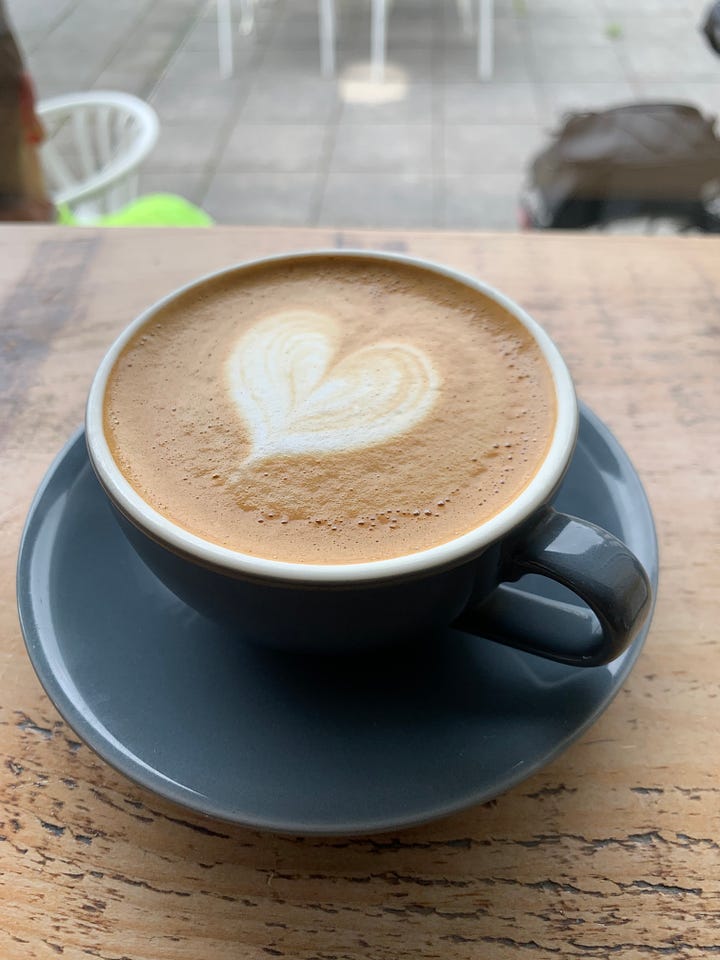 On the left, a picture of flat white with a heart latte art. On the right, overnight oats topped with sliced almond