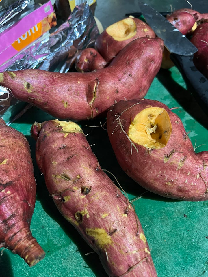 1. A very wonky sweet potato that looks like intestines, freshly dug up; 2. Washed sweet potatoes; 3. Sweet potatoes in foil just cooked in the fire; 4. Our roaring Samhain campfire.