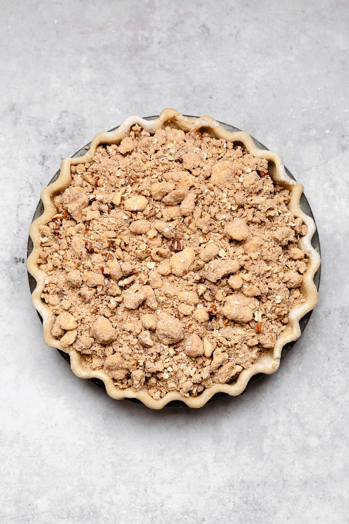 Process shots making bourbon peach crumb pie with vegan flaky pie crust and brown sugar oat crumb