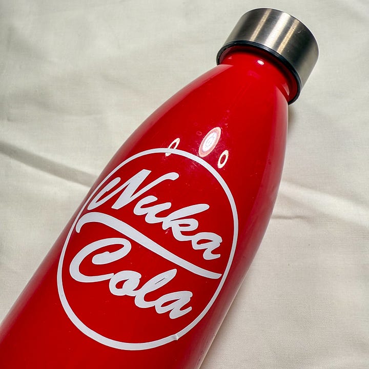 Red and silver water bottles with the words 'Nuka Cola'