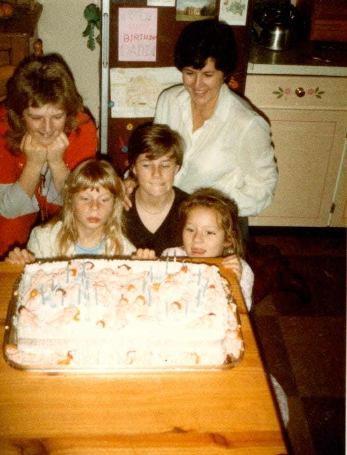 Women and childresn with a birthday cake