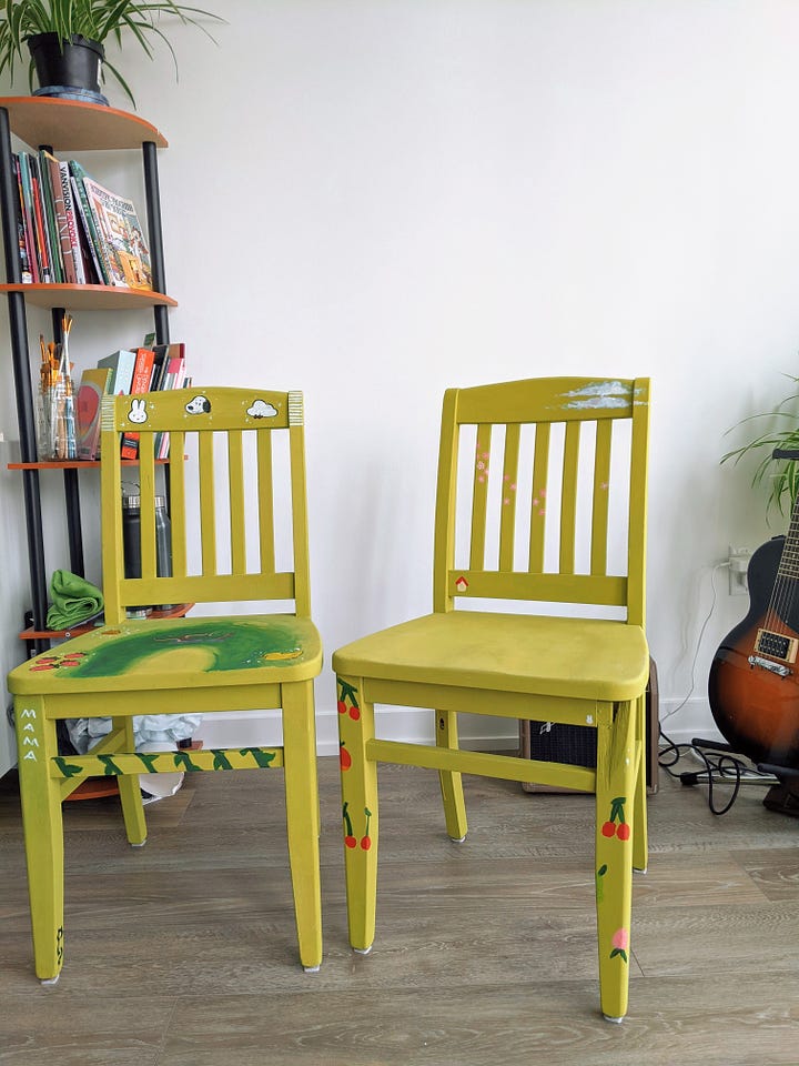 two green chairs, painted by hand and decorated with drawings of miffy, snoopy, animal crossing cherries, etc.