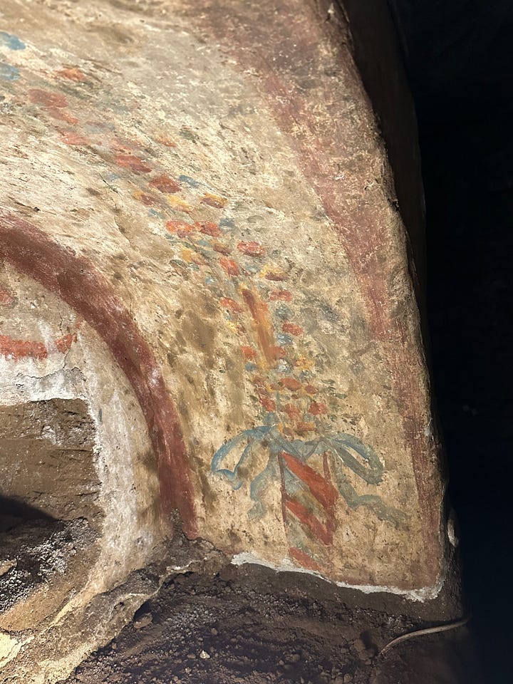 Decoration and utility in the catacombs. 1 and 2 are painted surfaces. 3 is an oil lamp in the shape of a fish embedded in the wall. 4 is more likely the name of the manufacturer of the earthenware slab than the name of the person who was buried there.