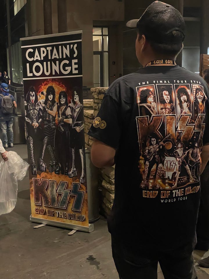 image on the left: KISS fan wearing KISS shirt in front of sign that says Captain's lounge. Middle image is mother and child wearing KISS make-up on the bus. Right image is KISS fans dressed up in make-up taking photos with non-make-up fans