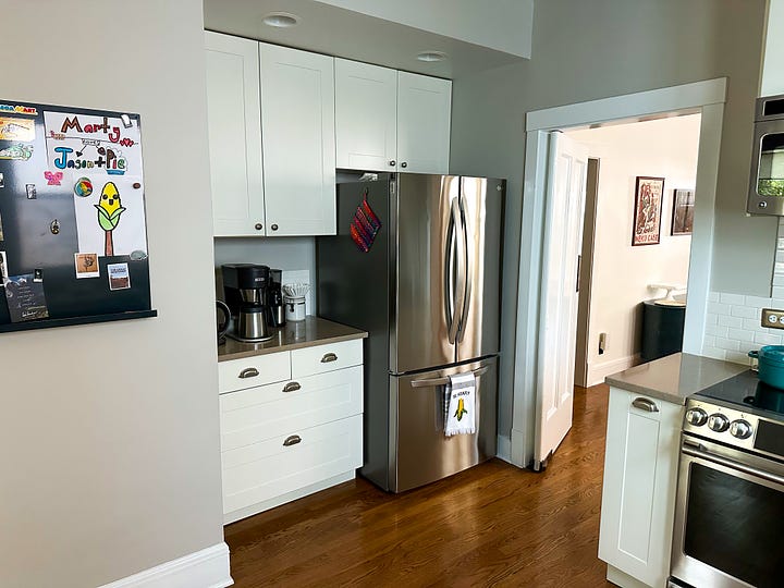 Kitchen with light coloured cupboards.