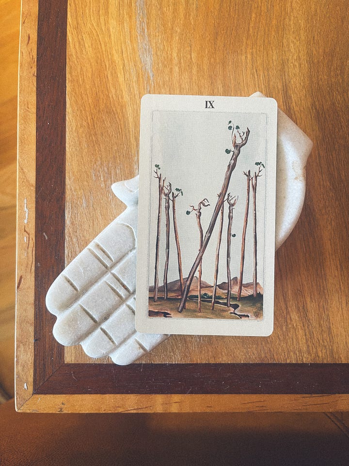 Four different images depicting the nine of wands