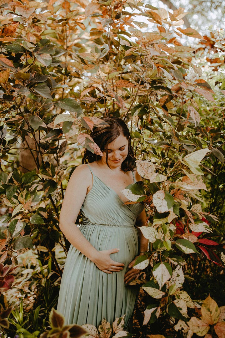 Four photos in shades of greens and coppers and gold, depicting Ganga Devi 6 months pregnant in a sage green gown surrounded by copperleaf plants and gold brocade fabric. In the background of the final photo, etched glass reads the lines from Stanley Kunitz: "The Universe is a continuous web, touch it at any point and the whole web quivers.""