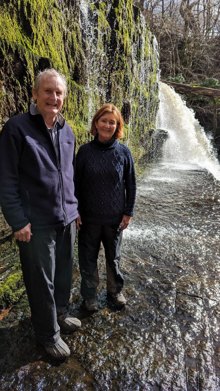 two hikers in the waterfalls area of the brecon beacons