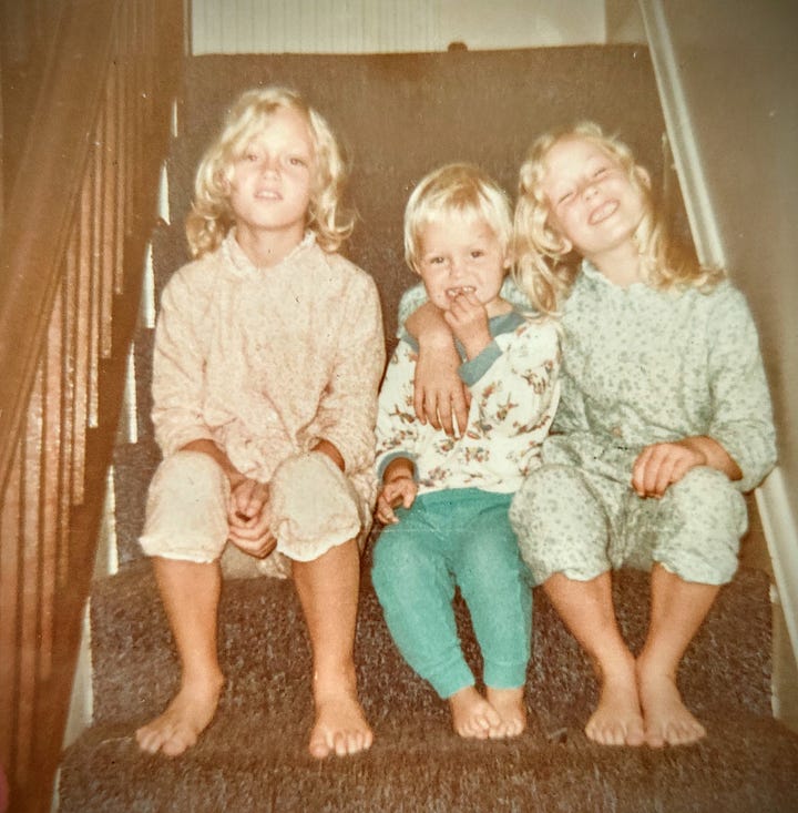 1. A black and white image of the author's father, Dr. Ken Warden, standing next to his car. He is wearing a hat and raincoat and has a pipe in his mouth. father.  2. A colour photo of the author as a child with her two sisters. The girls are sitting on a carpeted staircase at home.