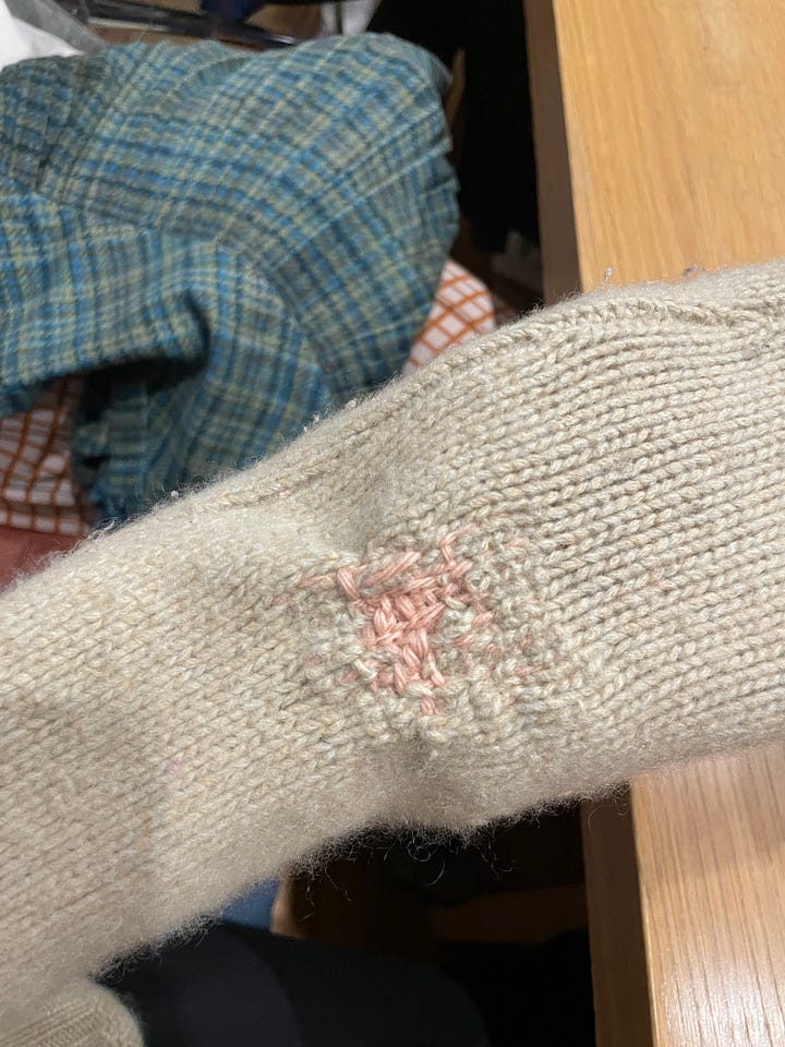 Two photos of darning on sweaters 