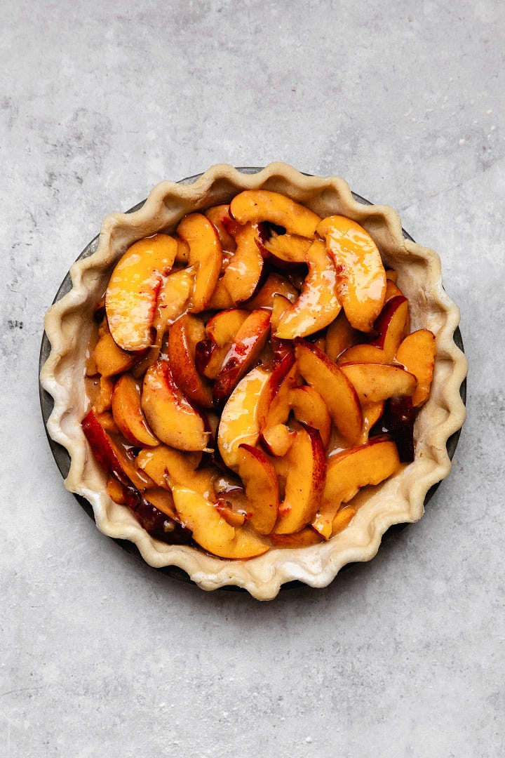 Process shots making bourbon peach crumb pie with vegan flaky pie crust and brown sugar oat crumb
