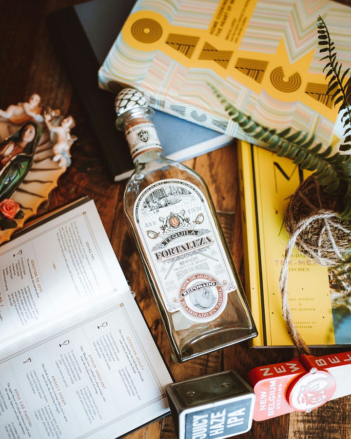Tequila sidewalk sign. A bottle of Fortaleza Tequila. Photos Gonzalo Sarno and Christopher Alvarenga, Unsplash.
