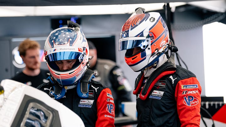 BMW M Team RLL drivers discuss strategy before the IMSA Monterey round at Laguna Seca in May 2025. Photos by Walter Fulbright.