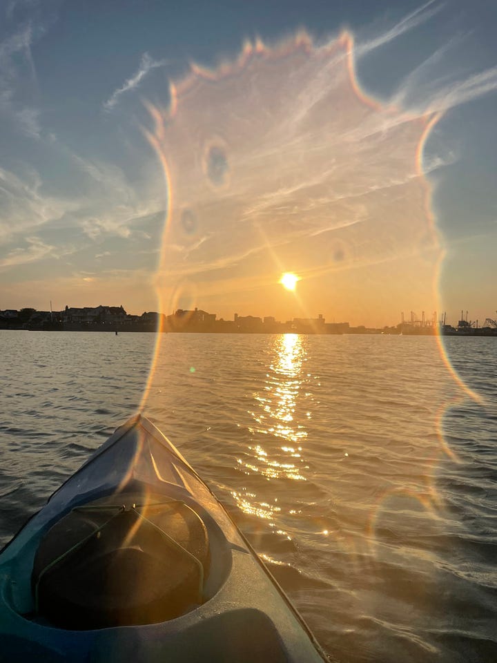 Sun and moon over the marsh while kayaking