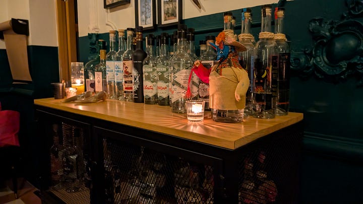 Our wonderful mezcal guide hosting our tasting at Salon de Agavé in Mexico City. A Some more of the many, many bottles she has on offer at tasting events..