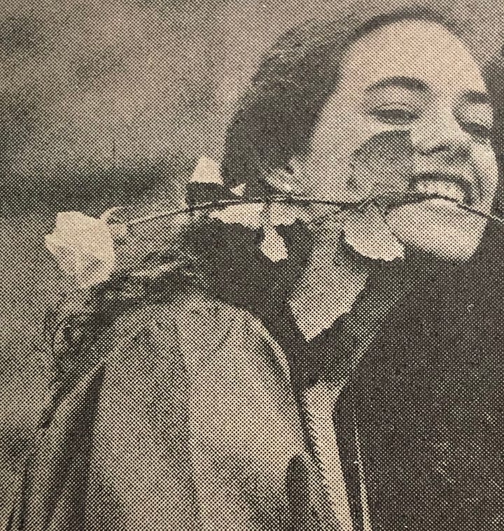 Flashing "tah-dah!" in rainbow tie-dye, being a ham with a rose in my mouth, blubbering in my graduation cap and gown, and sitting on my bed with a huge smile.