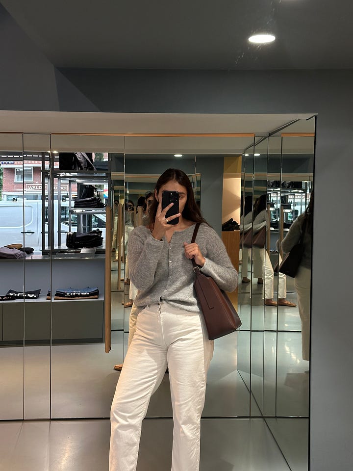 woman taking picture in mirror