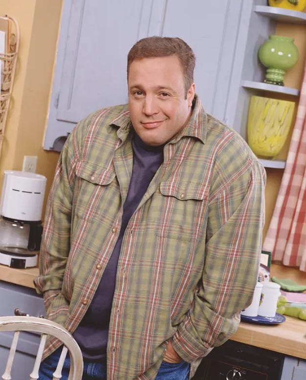 sculpture of a greek actor grinning wrapped in a sheet and Kevin James in a kitchen with hands in his pockets.