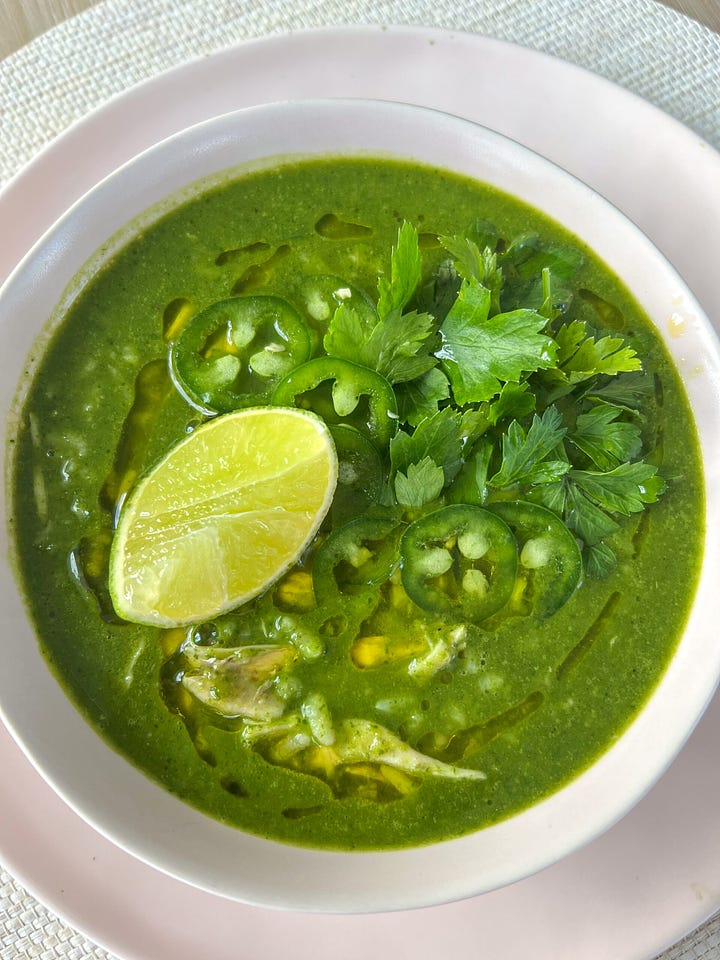 green soup with a lime on top