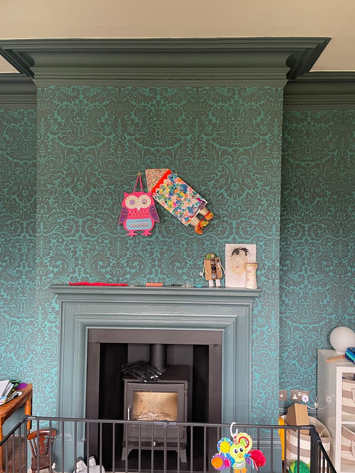 fireplace makeover before and after pink paint chimney breast storage built-in cupboards