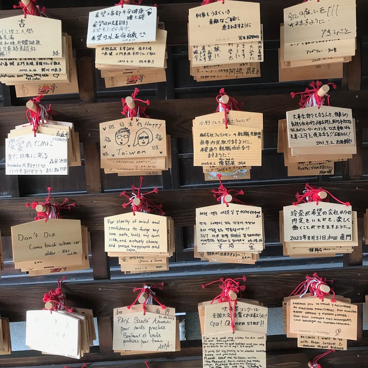 Pictures of Japanese prayers and fortune-telling strips left in shrines