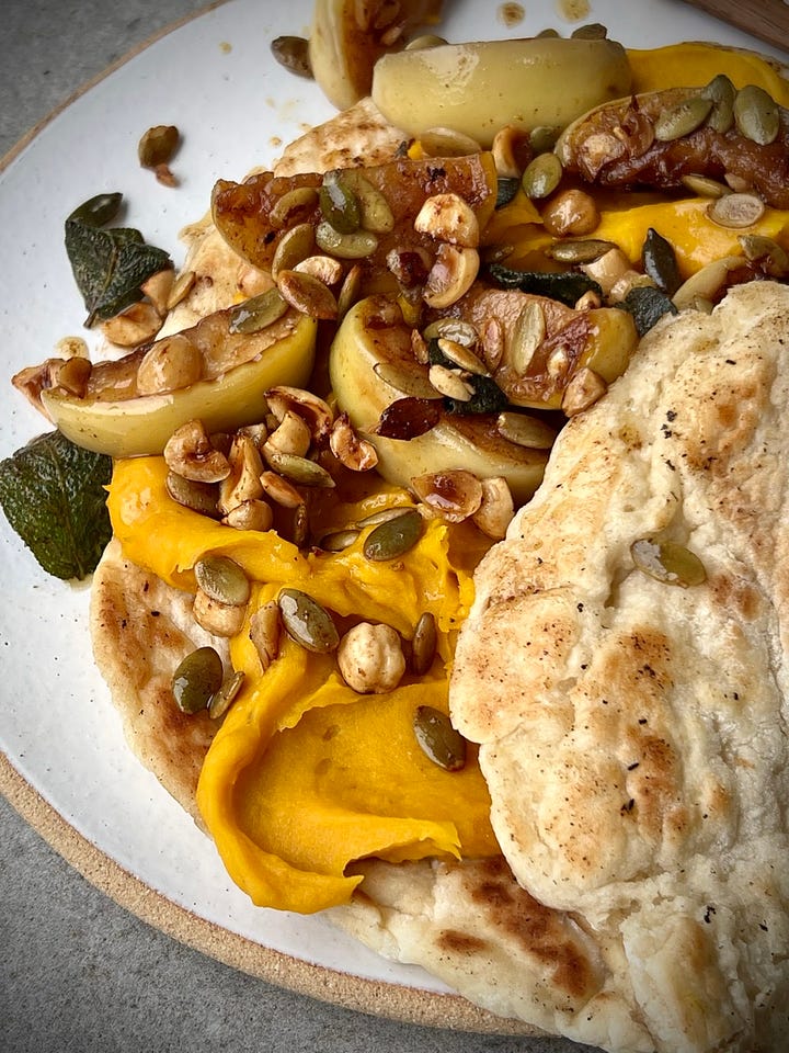 Pumpkin hummus flatbreads with fried apple and sage in various states of eating