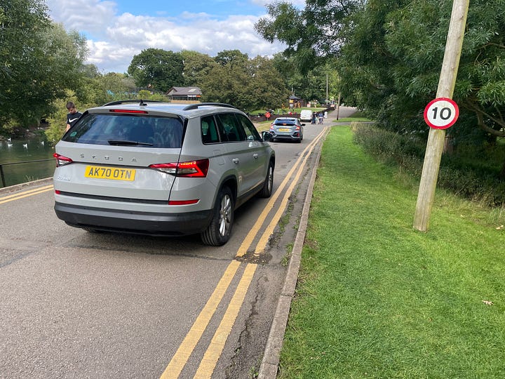 Cars driving and parked around Whipsnade Zoo