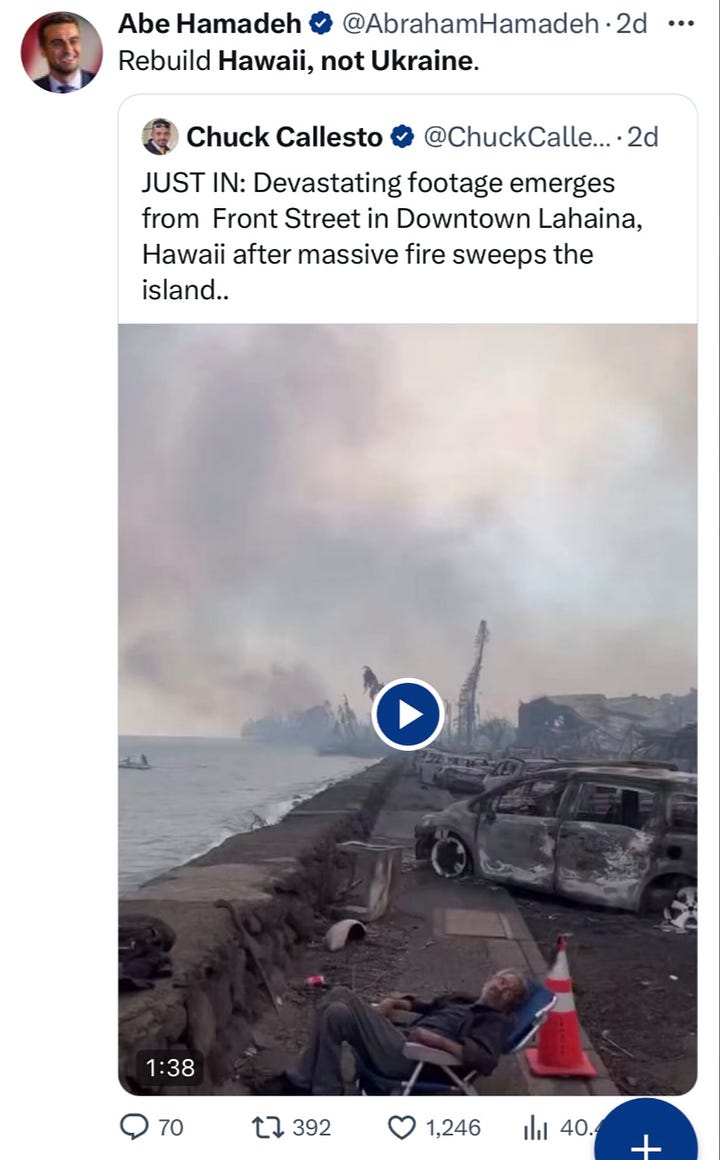 Still image from a video of the fires in Hawaii, showing a burning pile of rubble.