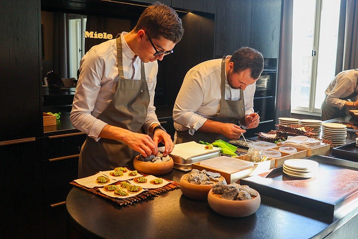 Atelier Moessmer kitchen team preparing snacks for the first courses of the 12-course lunch menu.