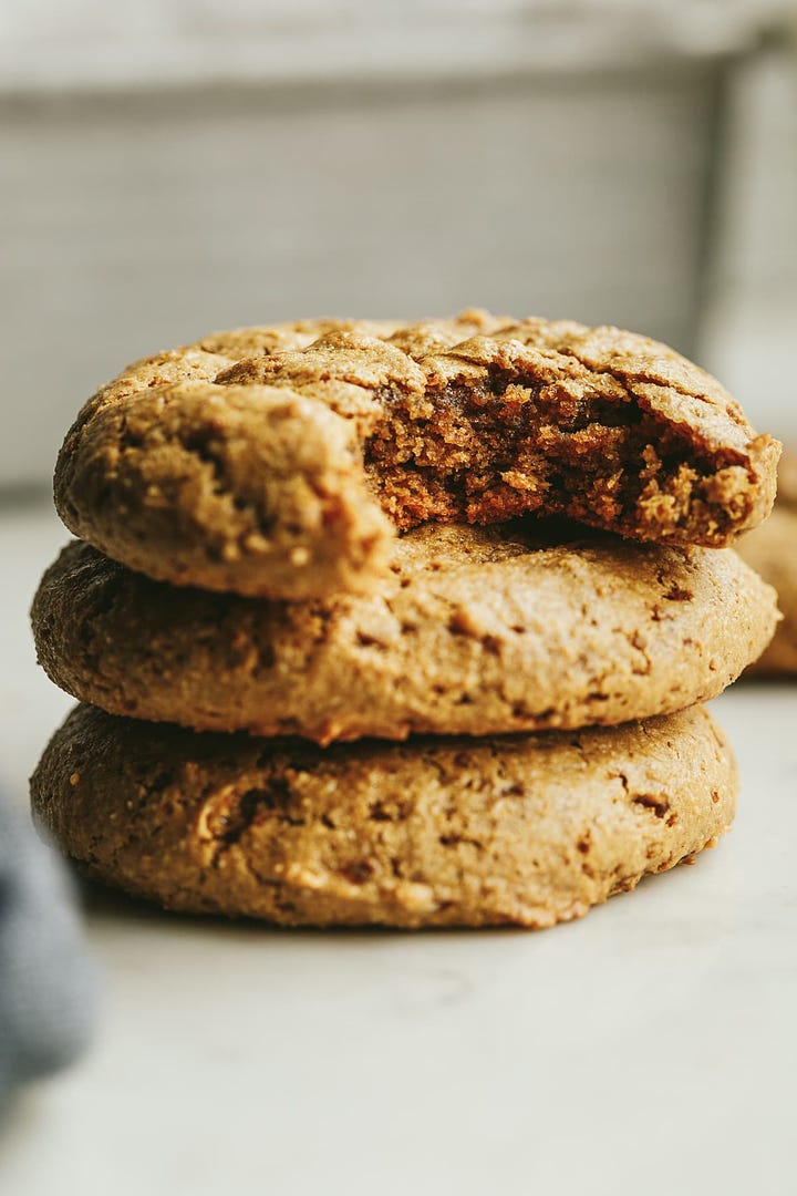 A plate of fall kale salad next to a photo of peanut butter cookies.