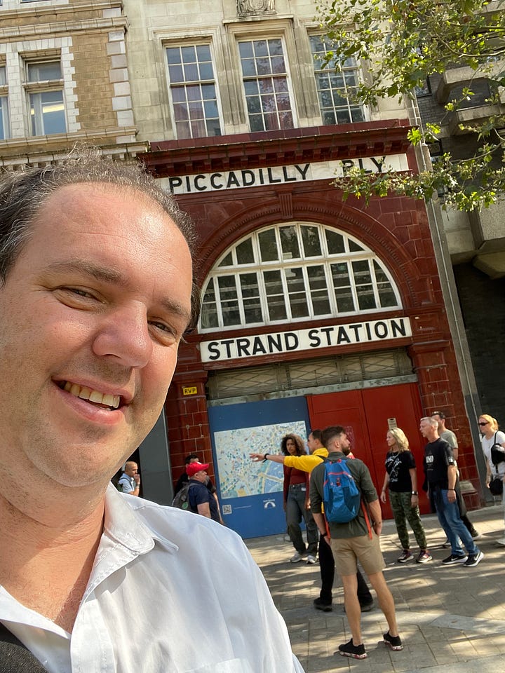 Pictures of the Strand Aldwych scheme. Many of the pictures are of pedestrian spaces, with extensive planting throughout and trees. People are walking in the street, and sitting at provided benches. There is one picture with someone on a bicycle, and another picture with my outside the disused Strand station