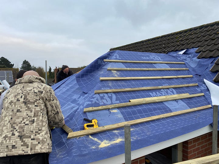 batons being added on top of the felt for the roof to now be watertight