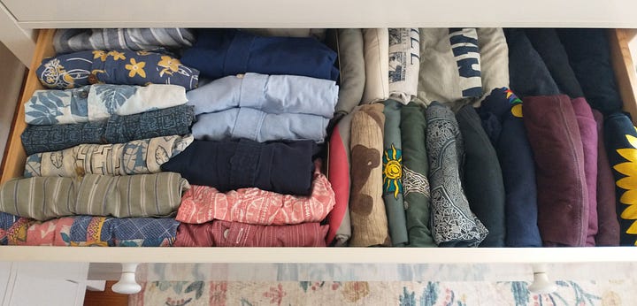Shirs, hats, sweatshirts and yes, even underwear, arranged in color-coordinated rows in drawers and on hangers.
